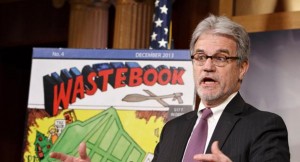 While the Senate debates the bipartisan budget plan, Sen. Tom Coburn, R-Okla., a longtime deficit hawk, outlines his annual “Wastebook,” which points a critical finger at billions of dollars in questionable government spending, Tuesday, Dec. 17, 2013, during a news conference on Capitol Hill in Washington.  (AP Photo/J. Scott Applewhite)