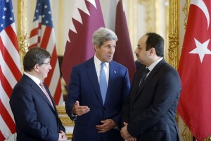 From left, Turkish Foreign Minister Ahmet Davutoglu, U.S. Secretary of State John Kerry and Qatari Foreign Minister Khaled al-Attiyah speak after their meeting regarding a cease-fire between Hamas and Israel in Gaza on Saturday. Agence France-Presse/Getty Images