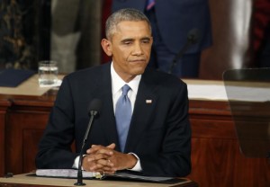 During a pause in his speech, Obama rests after declaring he would veto Republican efforts...