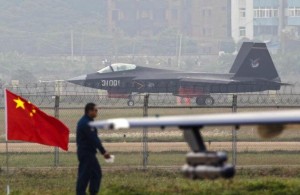 A J-31 stealth fighter (background) of the Chinese People's Liberation Army Air Force lands on a runway after a flying performance at the 10th China International Aviation and Aerospace Exhibition in Zhuhai, Guangdong province, Nov. 11, 2014. Reuters/ Alex Lee