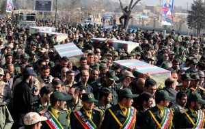 Members of the Iranian Revolutionary Guard carry the caskets of Iran's Revolutionary Guards Brigadier General Mohsen Ghajarian and other Iranian "volunteers", who were killed in the northern province of Aleppo by jihadists in Syria, during their funeral procession in the capital Tehran, on February 6, 2016. Brigadier General Mohsen Ghajarian of the elite Revolutionary Guards was killed in the northern province of Aleppo, according to the Fars news agency, which is close to the Guards. He was advising pro-government forces in the fight against the Islamic State (IS) jihadist group, it reported, without saying when he died. / AFP / ATTA KENARE