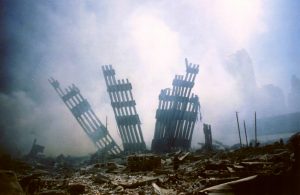 The remains of the World Trade Center stands amid the debris following the terrorist attack on the building in New York, Tuesday, Sept. 11, 2001. (AP Photo/Alexandre Fuchs)