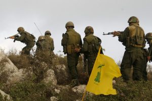A group of Hezbollah fighters take position in Sujoud village in south Lebanon September 13, 2008. Hezbollah reproduced the operation attack on an Israeli occupation position made by Hadi Nasrallah, a Hezbollah fighter and the eldest son of the group's leader Sayyed Hassan Nasrallah, to commemorate his death during the operation in September 13, 1997. REUTERS/ Ali Hashisho (LEBANON)